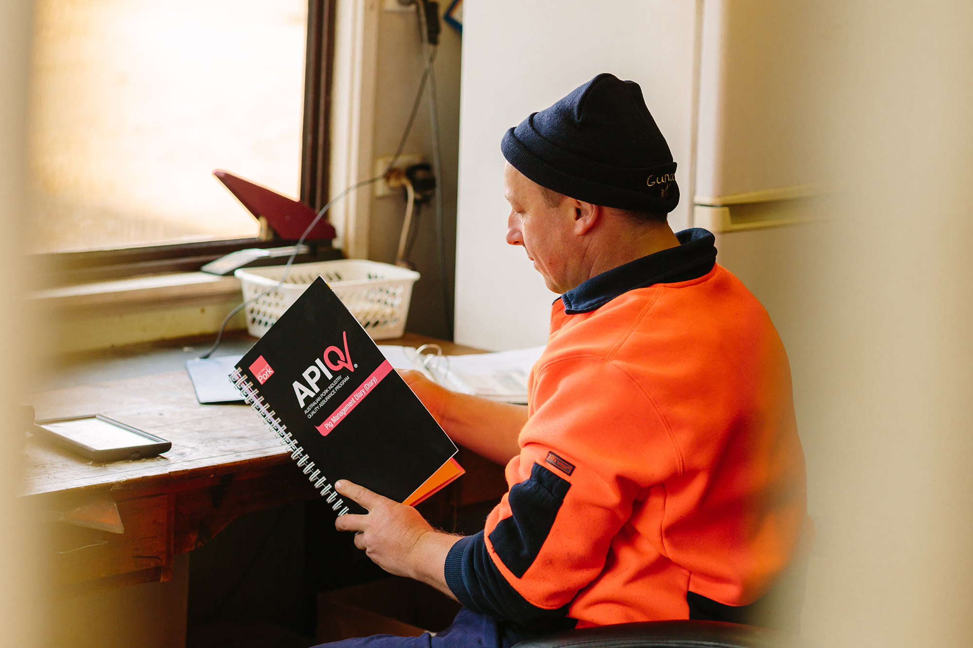 Worker with APIQ book